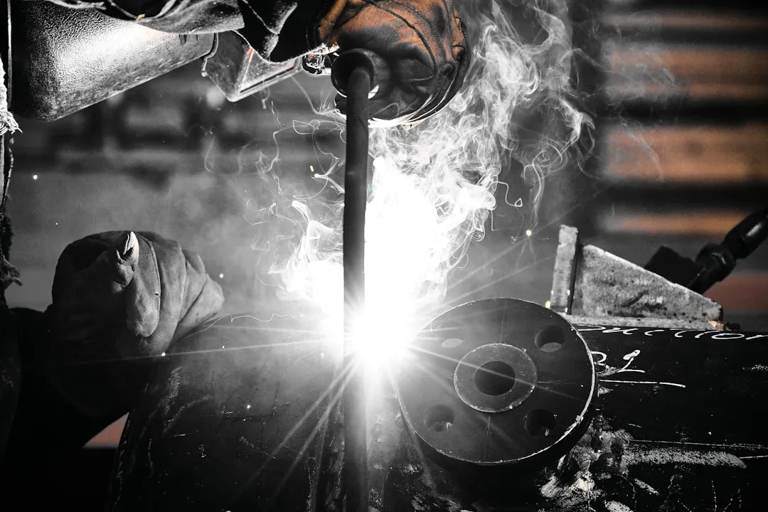 Professional welder in action with sparks flying